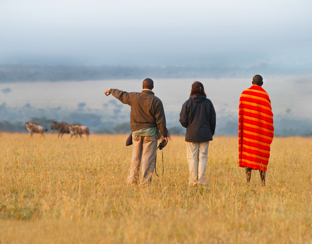 masaai with tourist in walking safari 