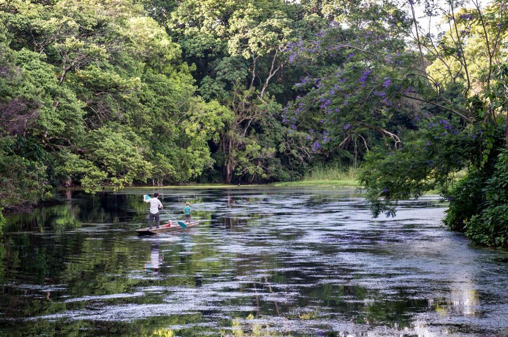 a father and son enjoying canoeing at Ngaresero river lounge