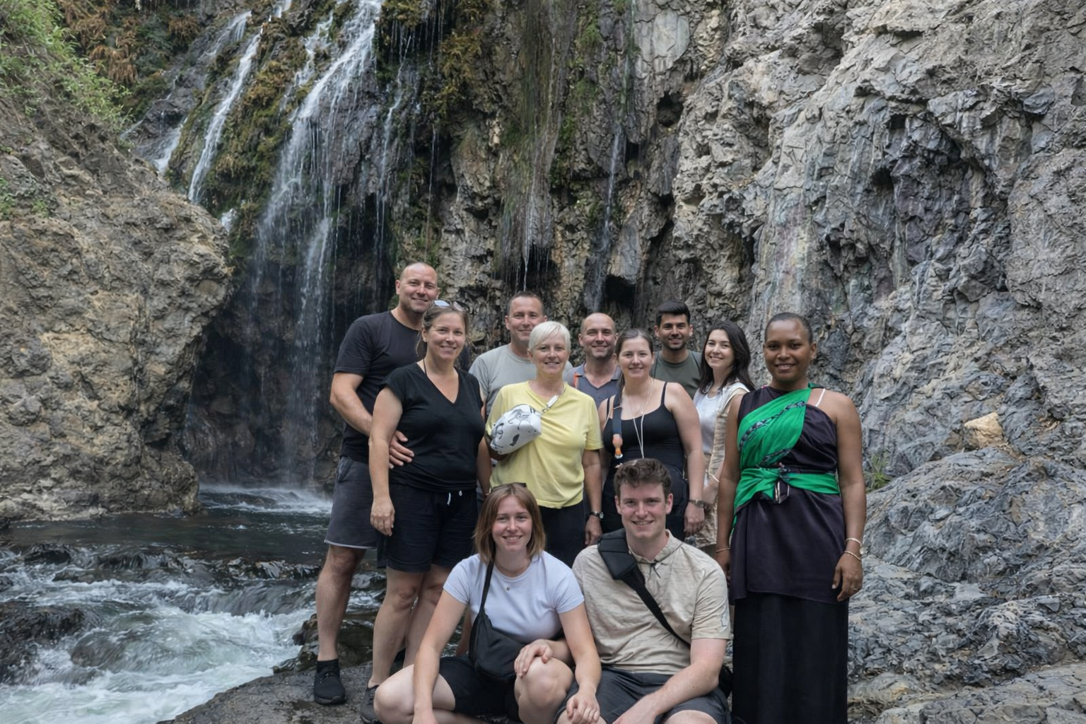 client at materuni water fall before an epic safari