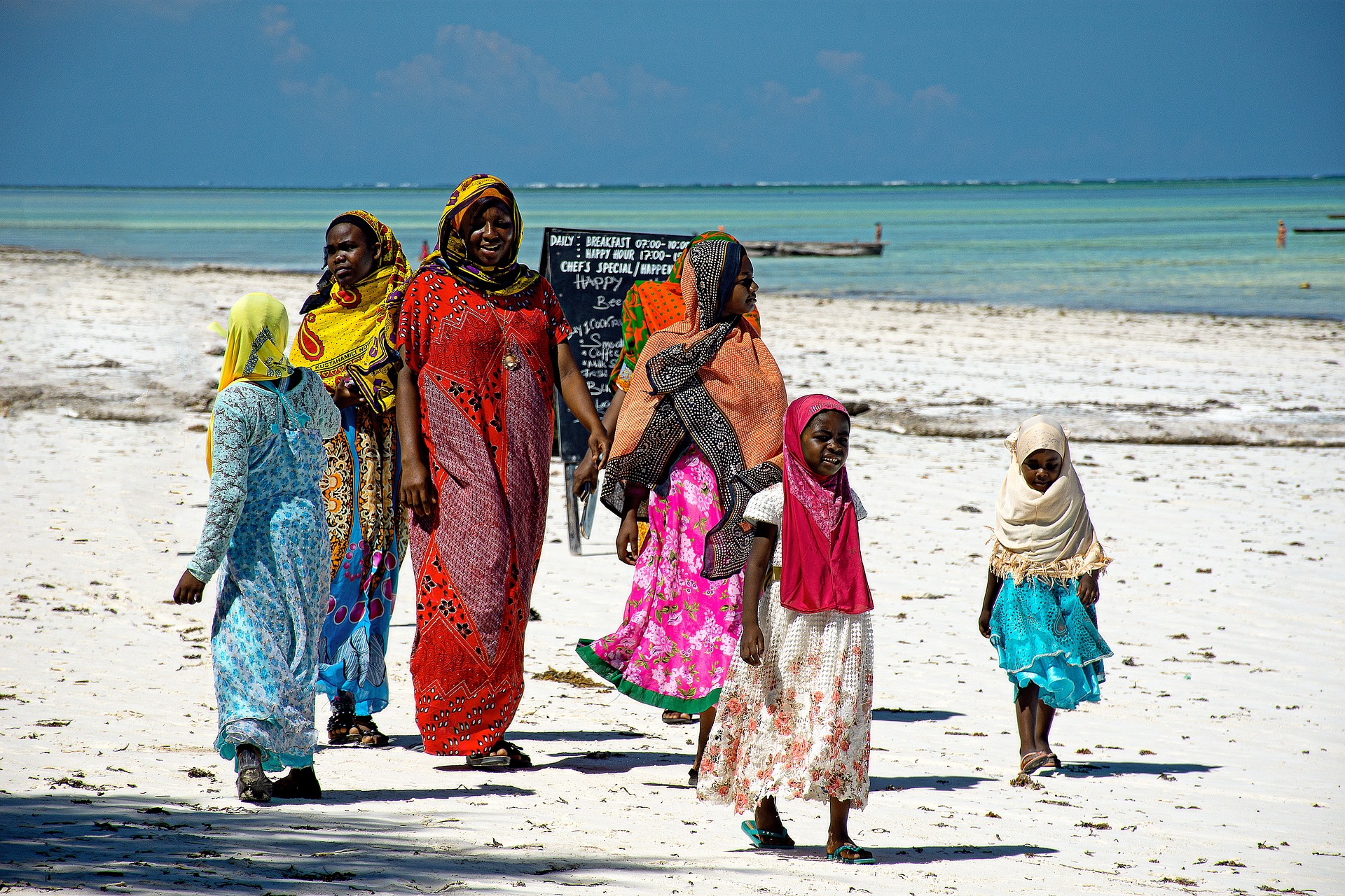 swahili family on walk on the beach